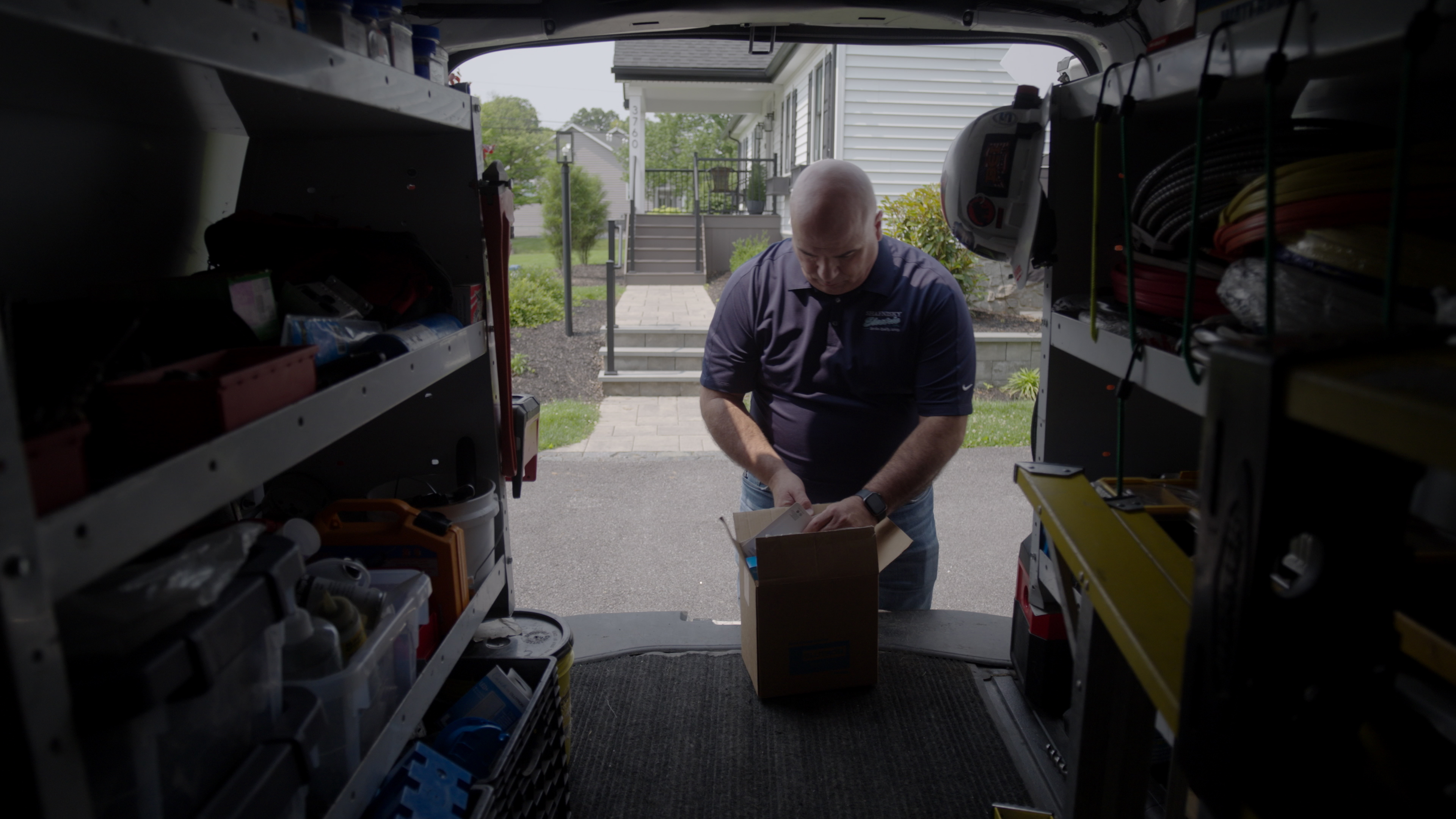 A Lutron Preferred Pro gathers stock from his truck.