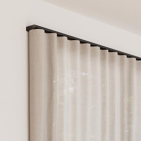 Palladiom drapery track and fabric mounted to wall.