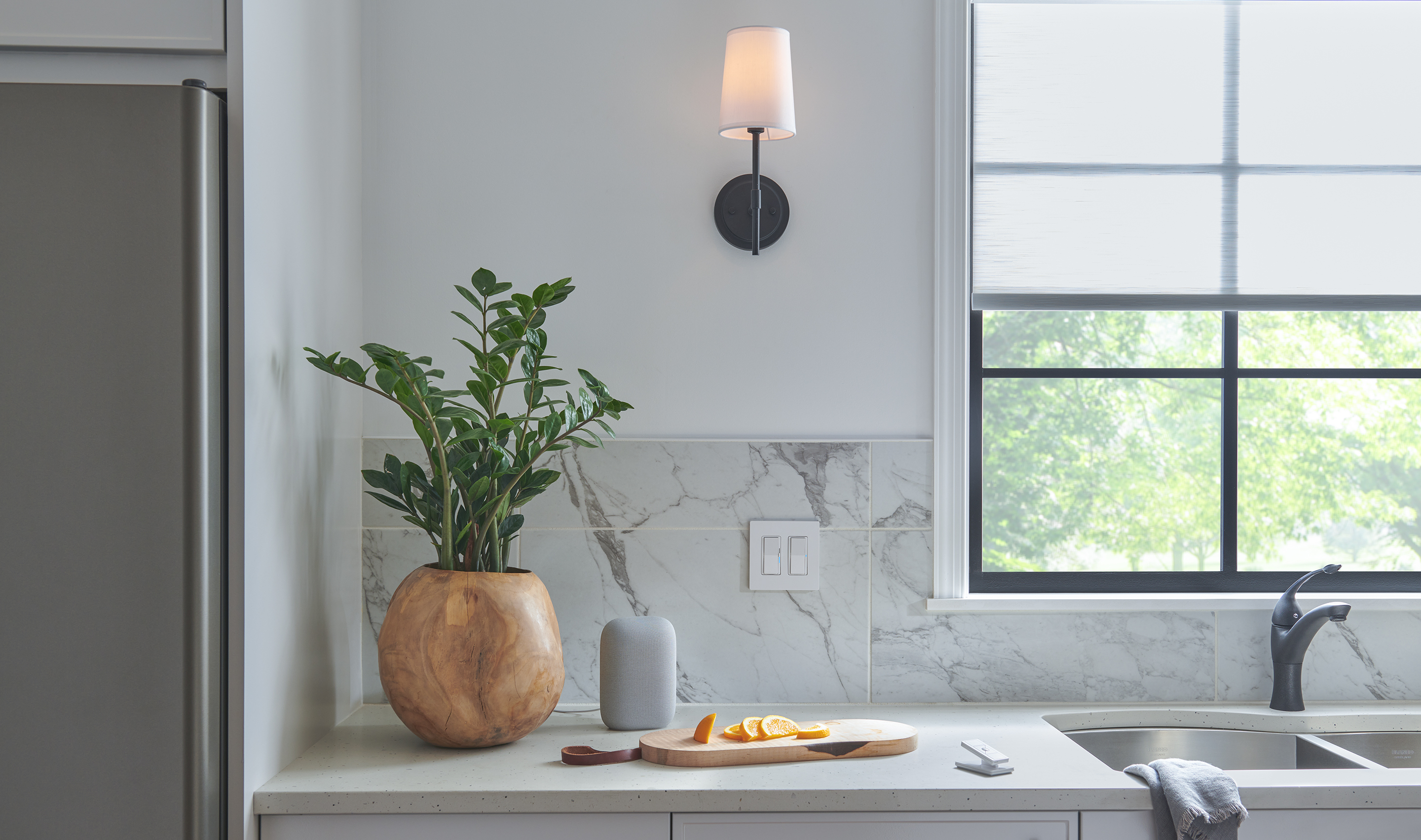 A Northeast private residence kitchen with Lutron Serena, Roller Shades, Caséta, Pico, and Dimmers & Switches.