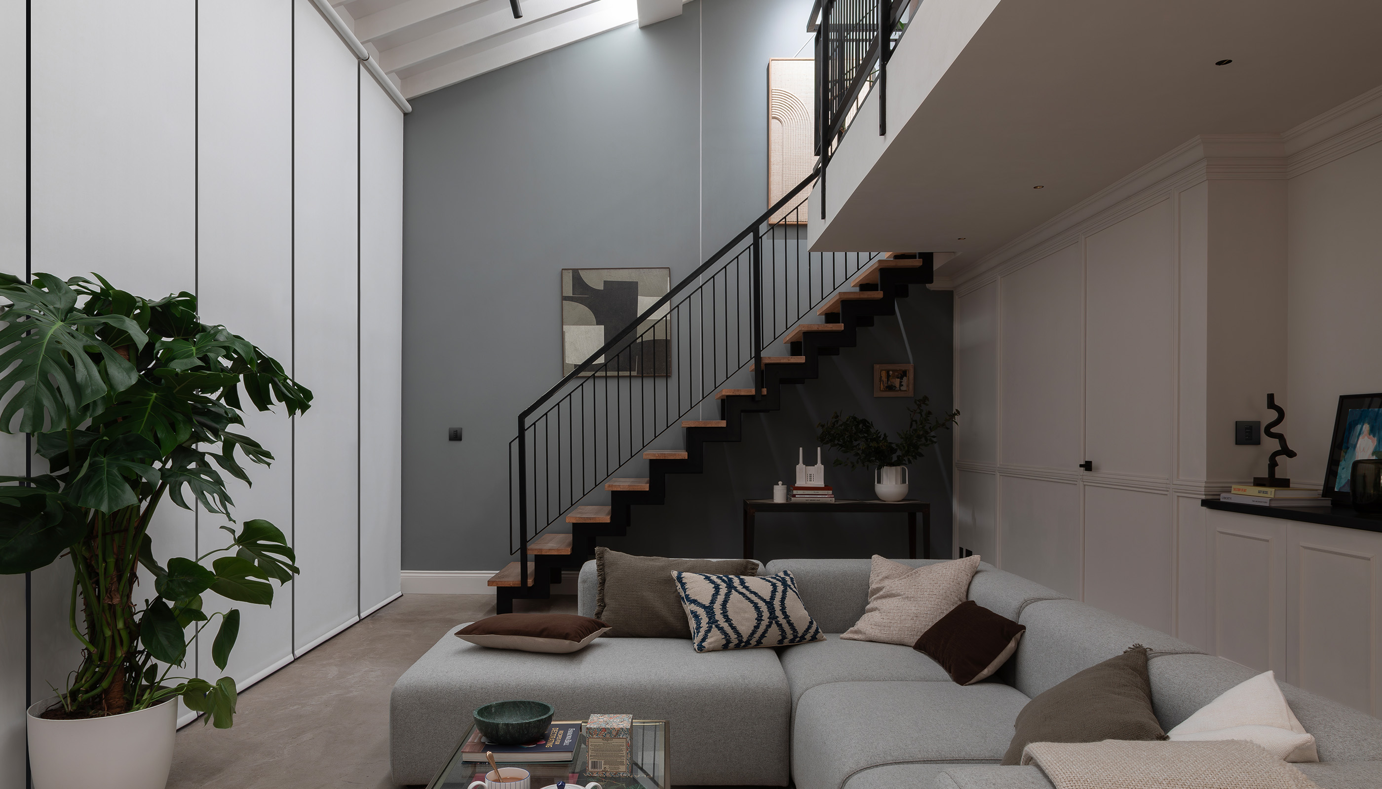 A London residential living room with Lutron Roller shades, Palladoim, Keypads & Remotes