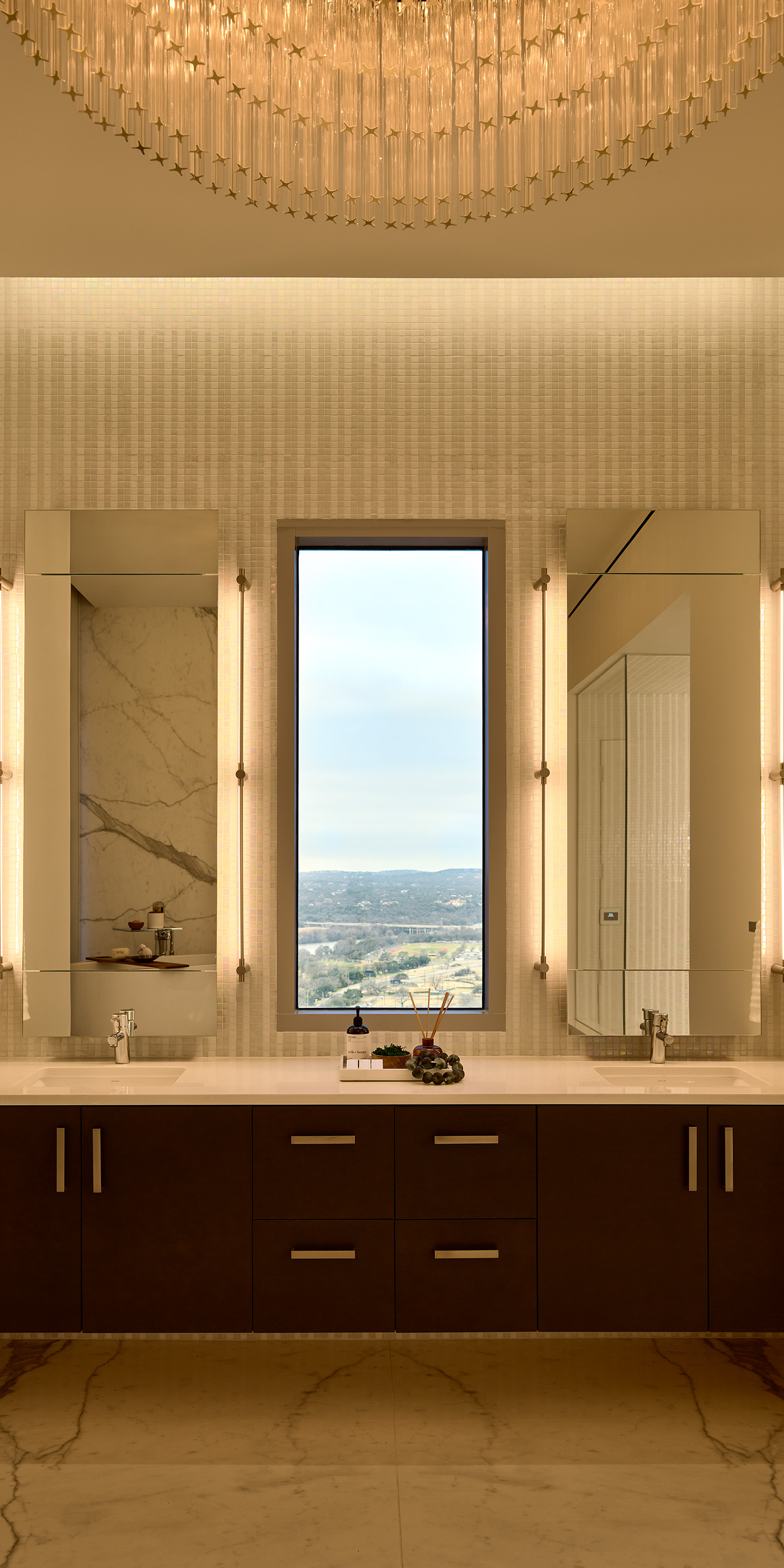 An Austin residential bathroom with Lutron Ketra lights, Palladiom roller shades, and HomeWorks.