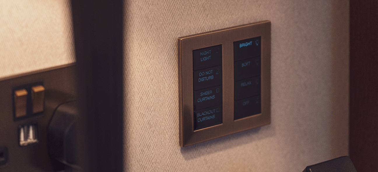 A close up of a Lutron Palladiom keypad in a guestroom at the Raffles London at The OWO