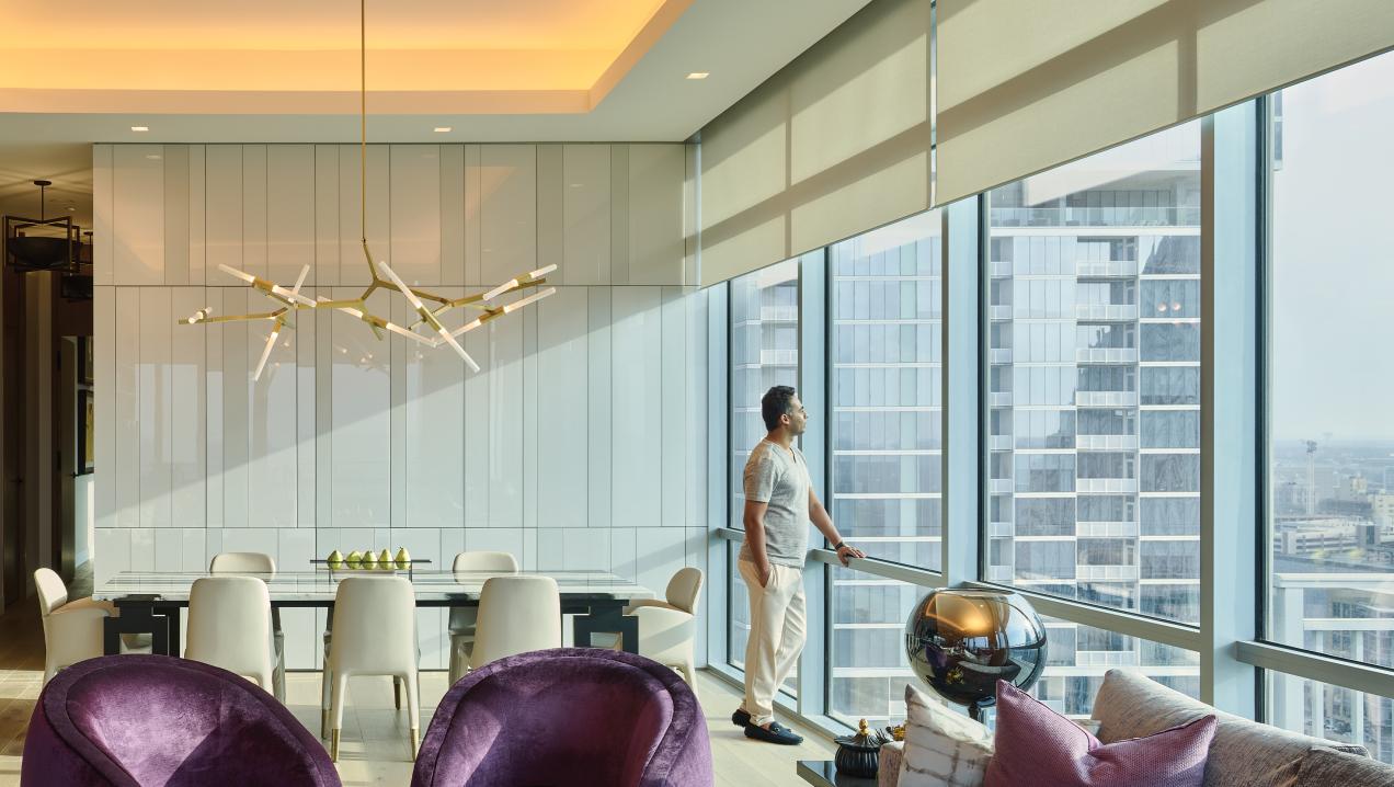 Lutron lighting in high-rise dining room harmonizing with natural light
