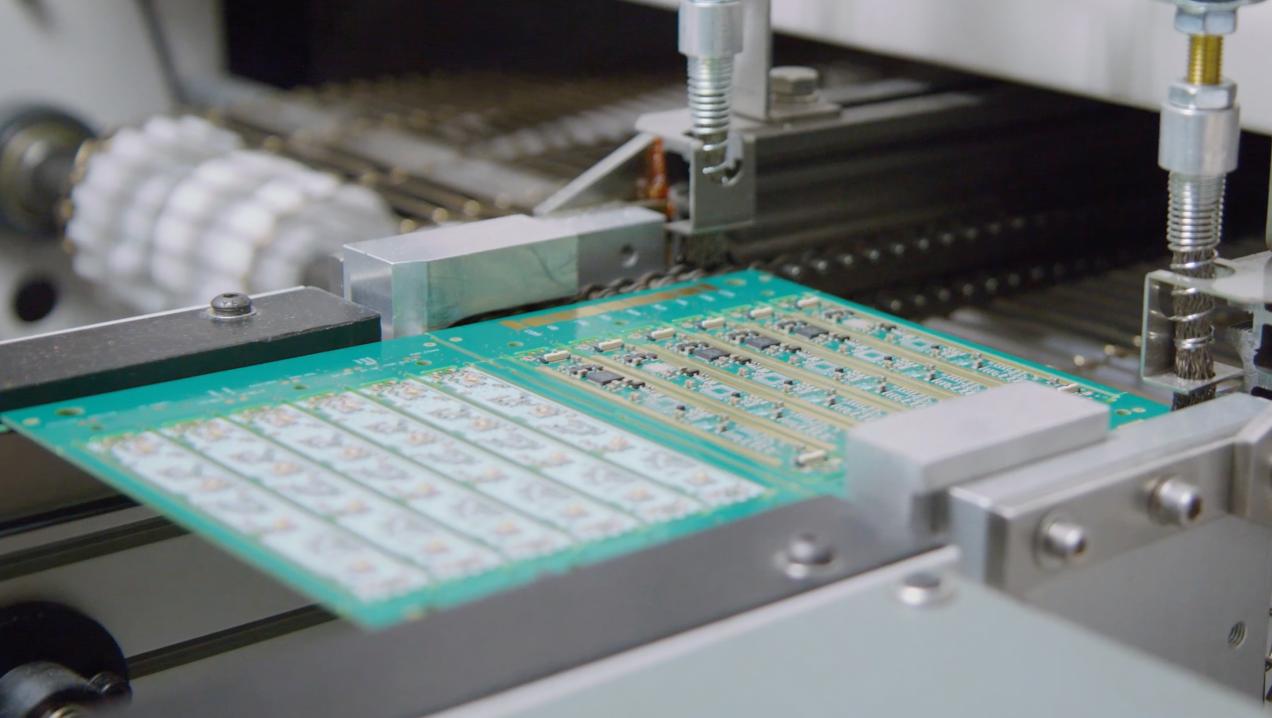 Circuit board in manufacturing equipment demonstrating Athena wireless technology engineering and quality standards 