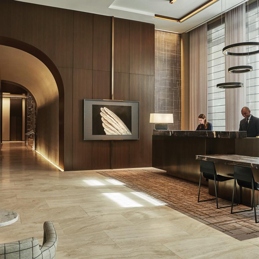 Hotel lobby with responsive lighting that syncs to time of day, supporting ambiance and operations across shared spaces