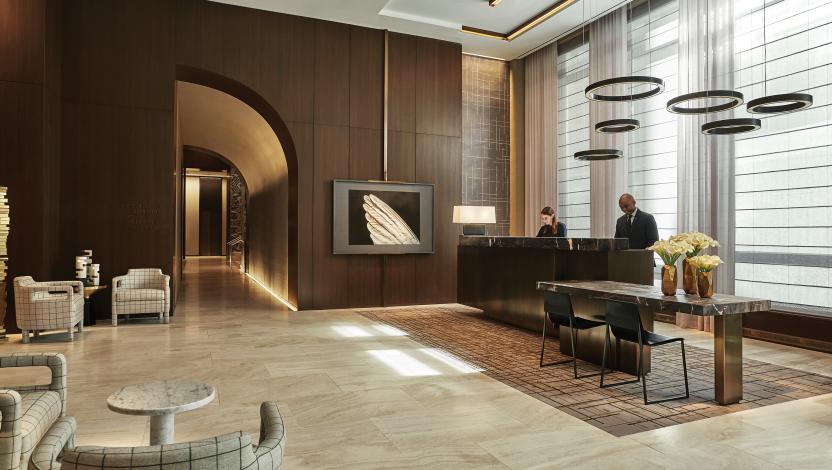 Hotel lobby with responsive lighting that syncs to time of day, supporting ambiance and operations across shared spaces