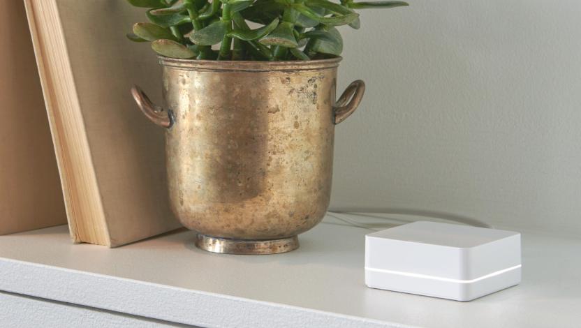 Caseta hub discreetly sitting on a  bookshelf.
