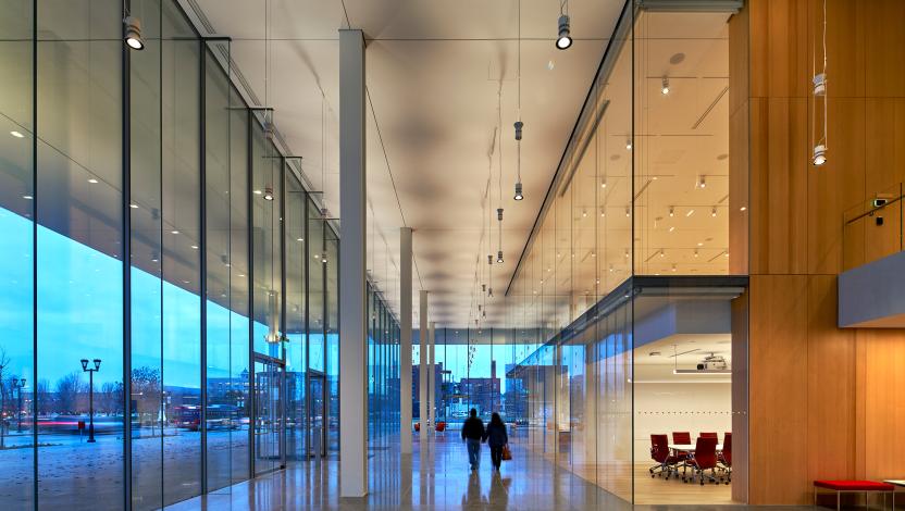 Commercial building lobby with intelligent downlights and linear luminaires.