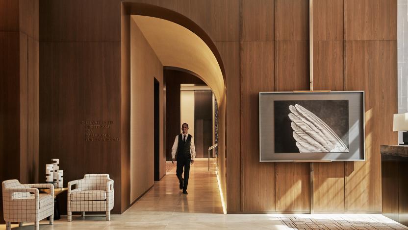 Luxury hotel foyer with warm architectural lighting.