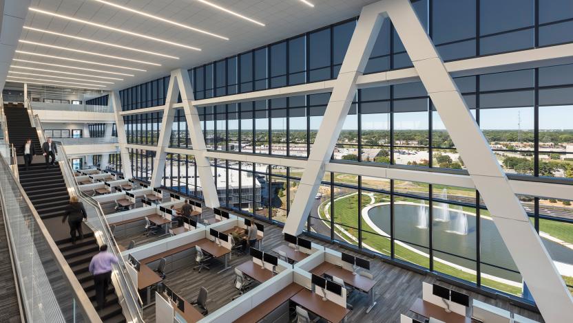 Multi-story office atrium with linear ceiling lighting control and automated shading.