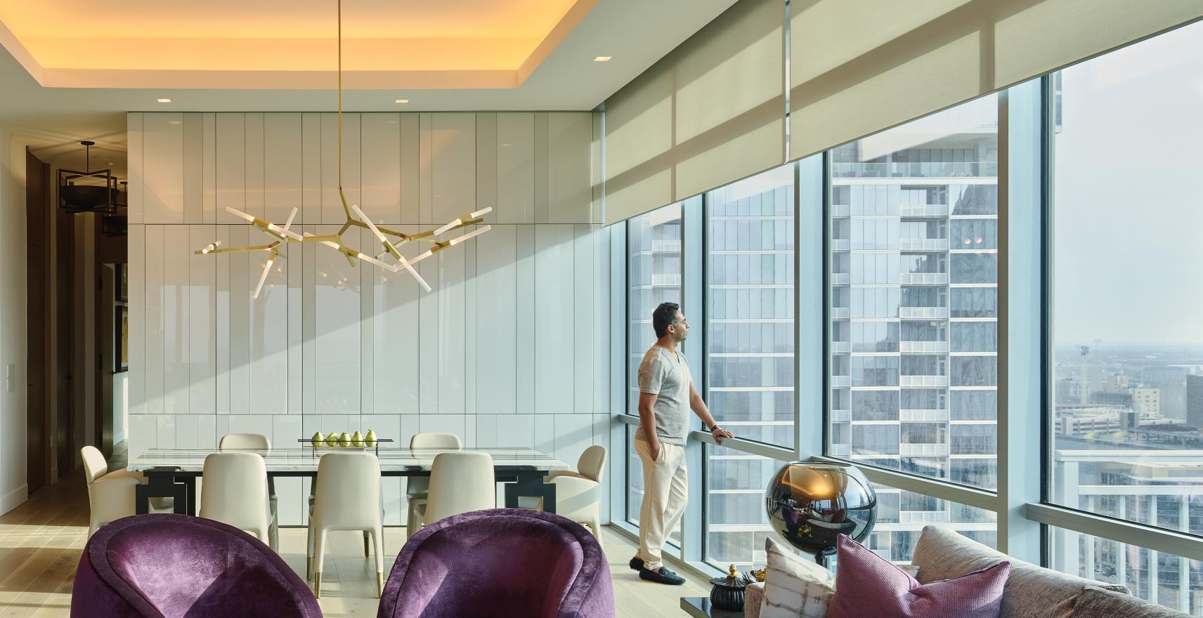 Lutron lighting in high-rise dining room harmonizing with natural light