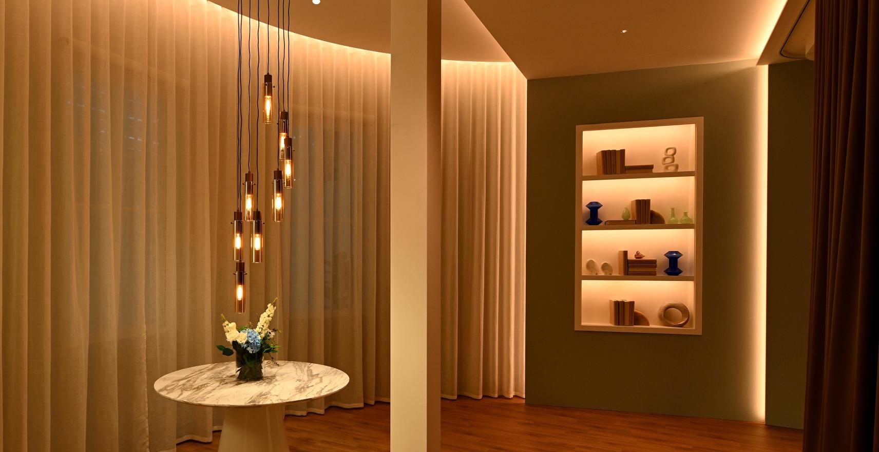 Lutron drapery tracks with straight and curved installation in a high-end commercial space.