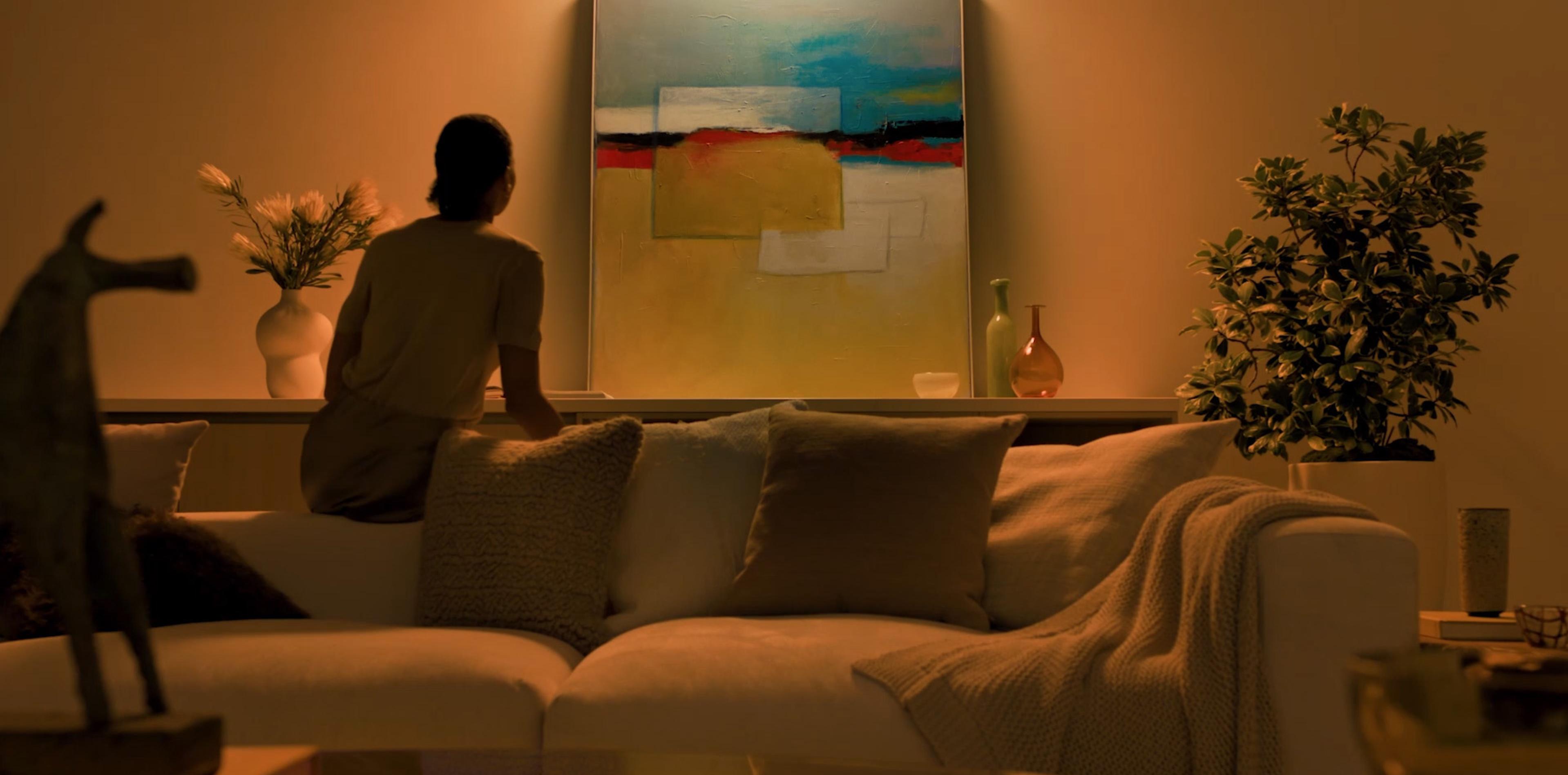 Warm ambient lighting in modern living room with abstract art and cozy seating