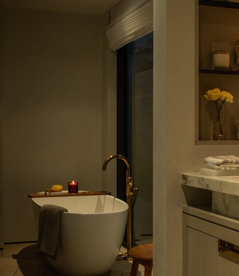 An Austin residential bathroom with Lutron Ketra lights, Roman shades, Sivoia and HomeWorks.