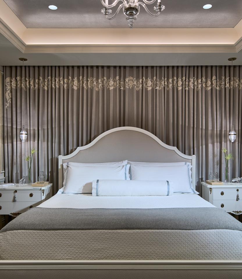 A New York City residential bedroom with Lutron downlights and HomeWorks