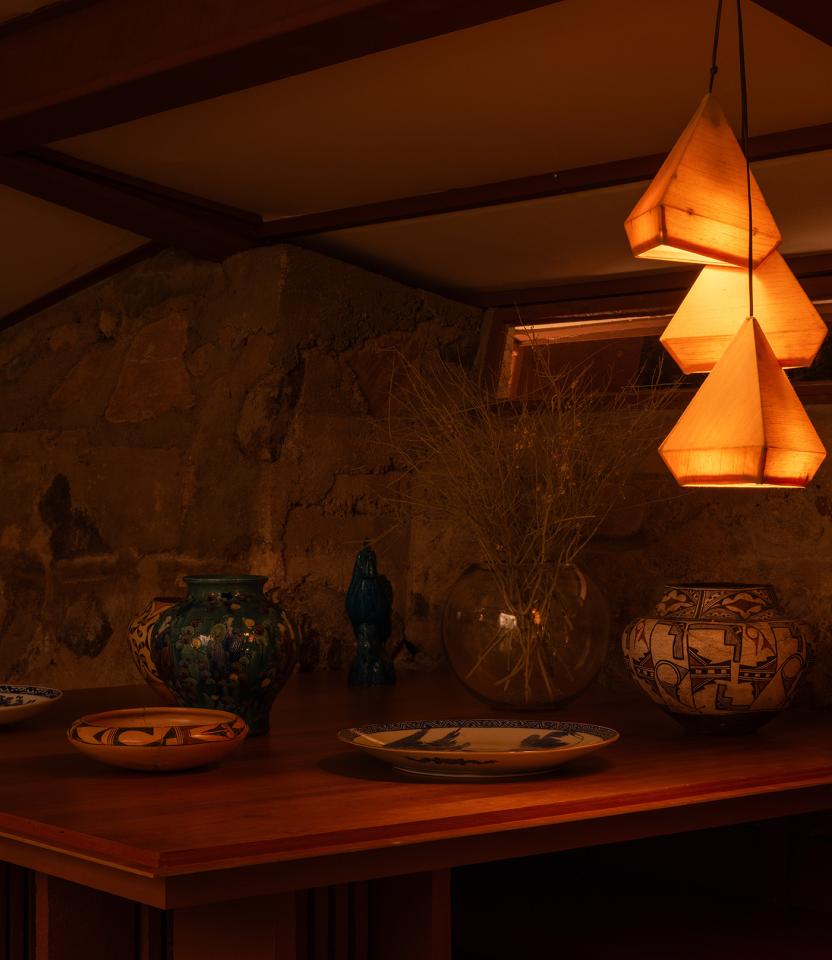 A Scottsdale residential dining room with Lutron Ketra lights, Roman shades, Sivoia and HomeWorks