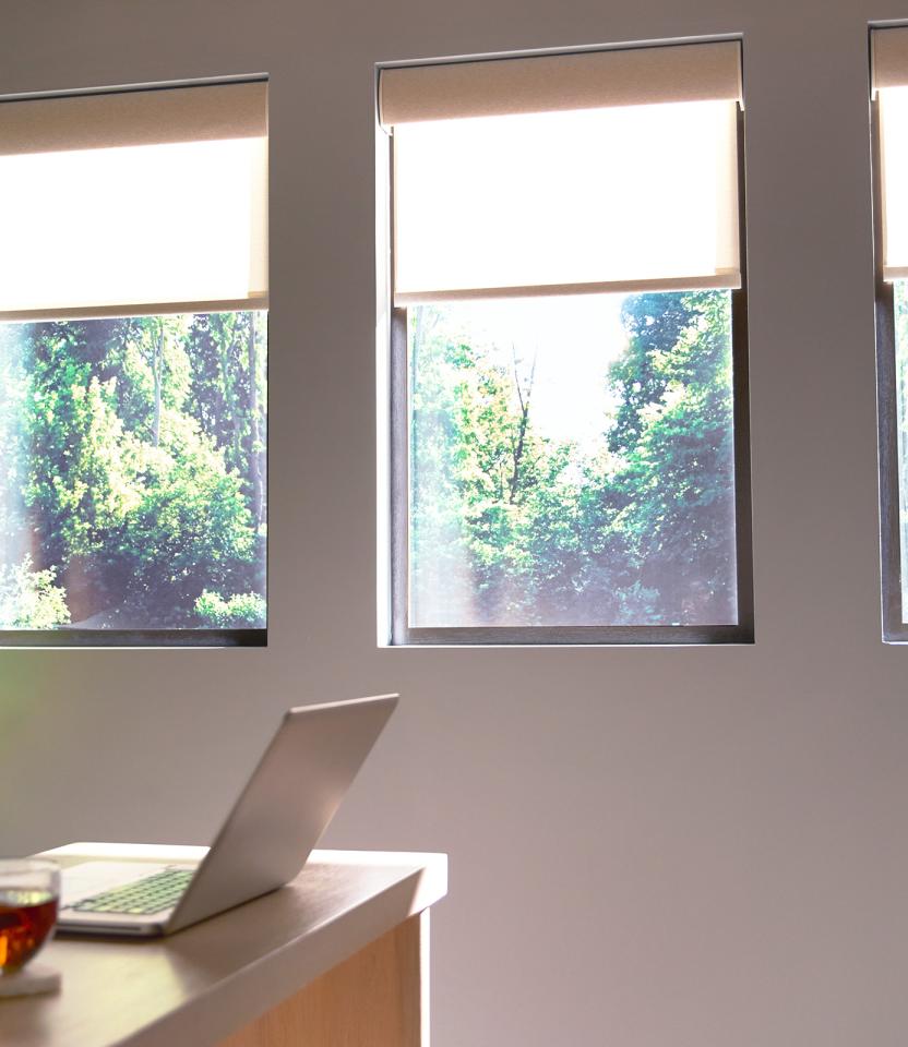 A Northeast private residence homeoffice with Lutron Serena, Roller Shades & Pico