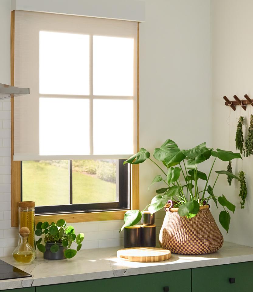 A Northeast private residence kitchen with Lutron Serena & Roller Shades
