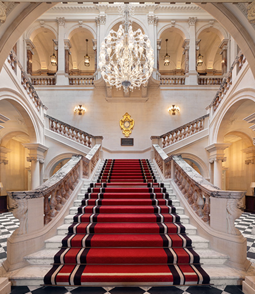 The grand staircase at Raffles London at The OWO hotel