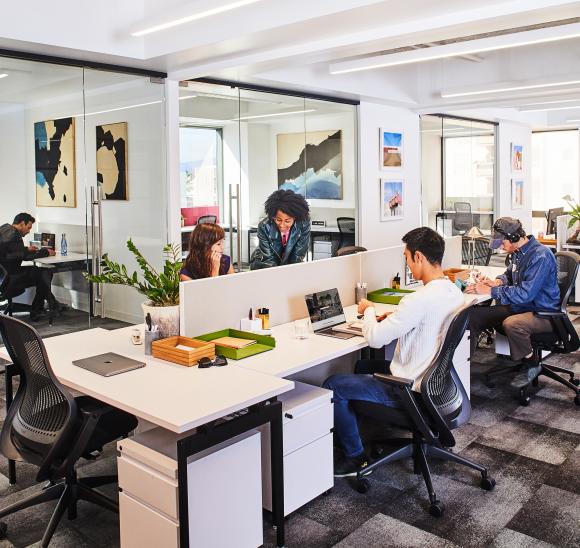 Open office layout with adjustable task lighting for employee focus.
