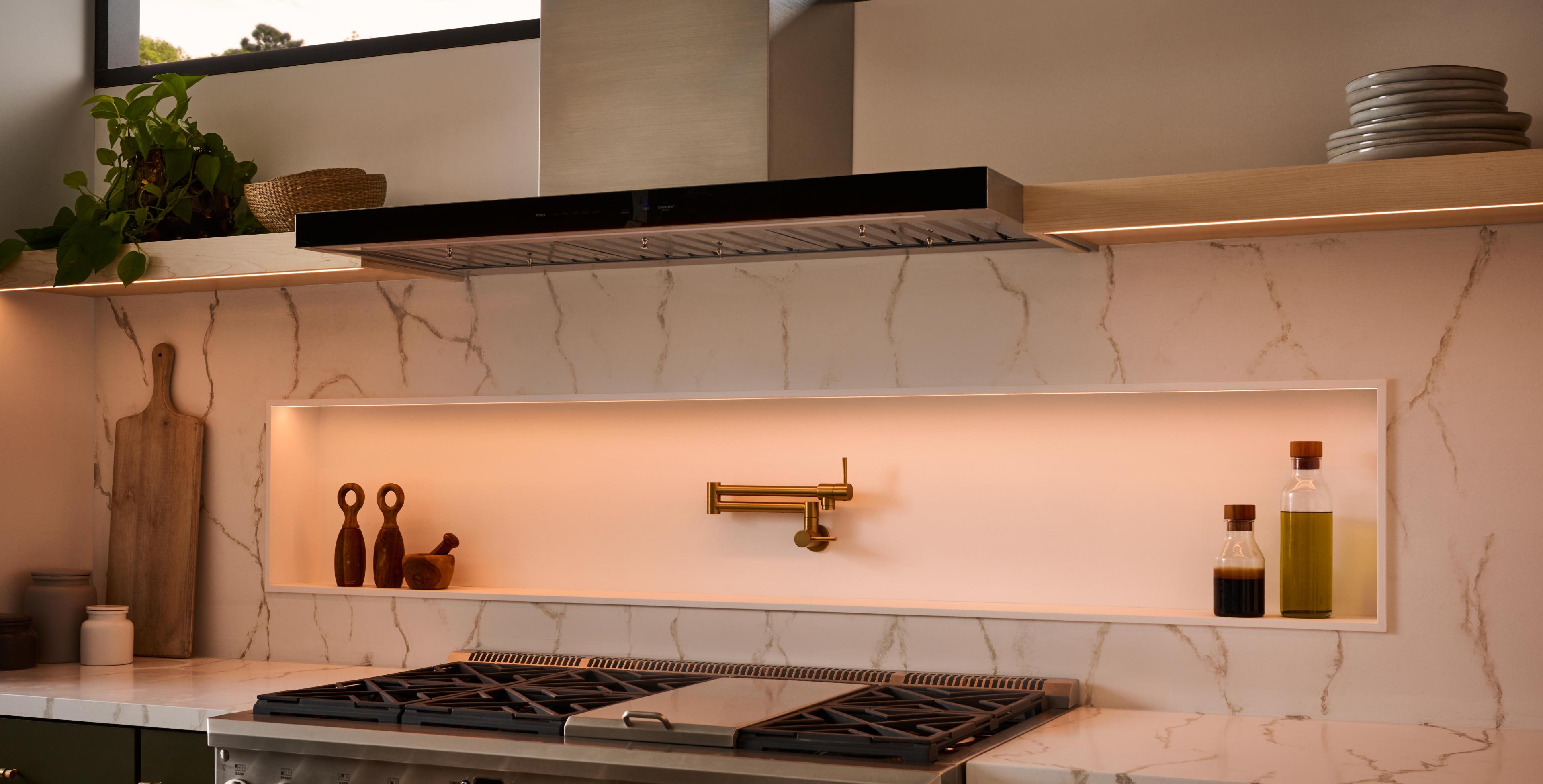 A  warm, ambient lighting sets the mood in a kitchen through the use of dimmable tape light.