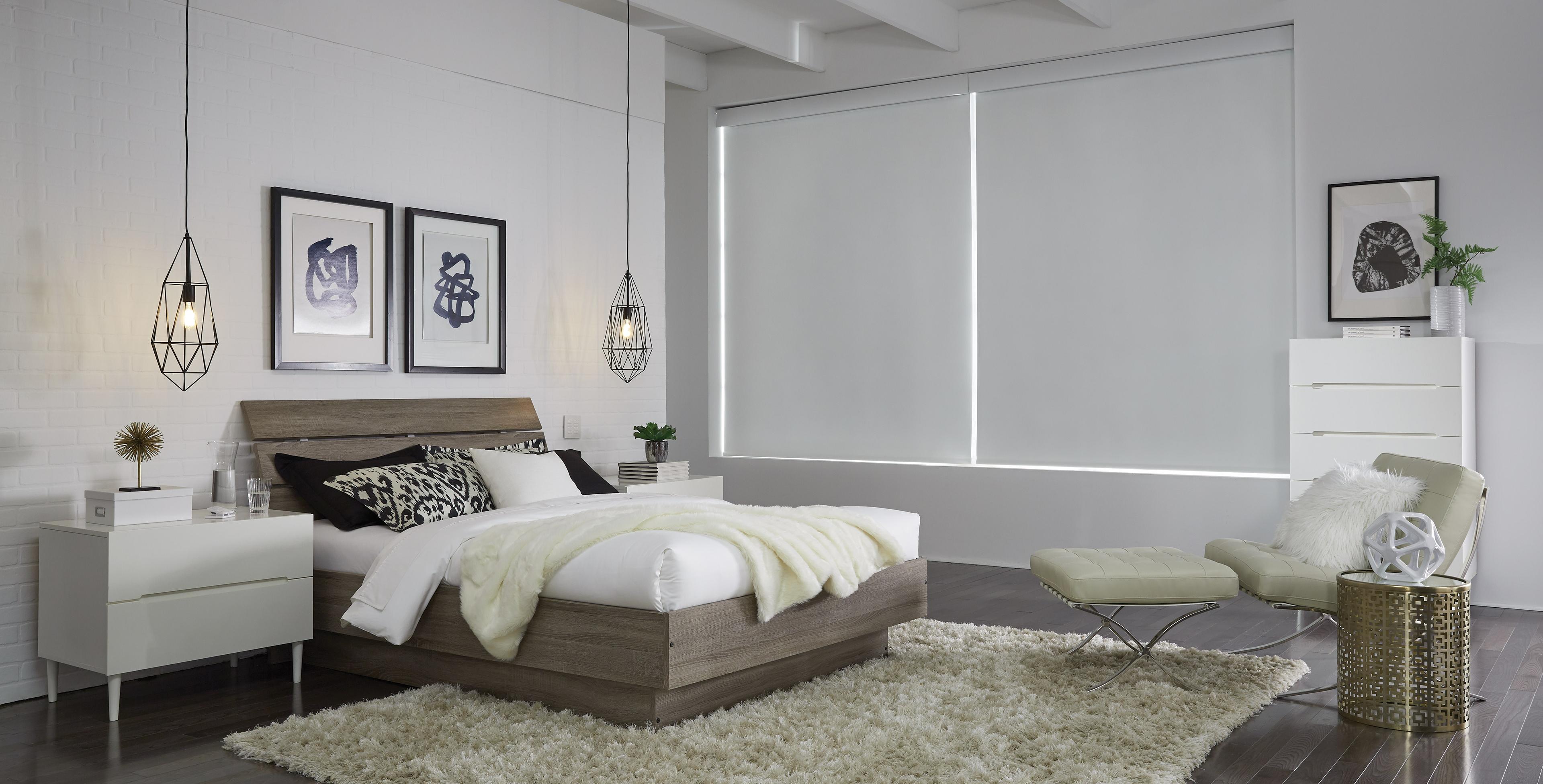 Modern, cream-colored bedroom with matching Triathlon shades concealing the outside view.