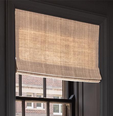 Wire-free Triathlon Roman shade featuring custom fabrics installed in window.