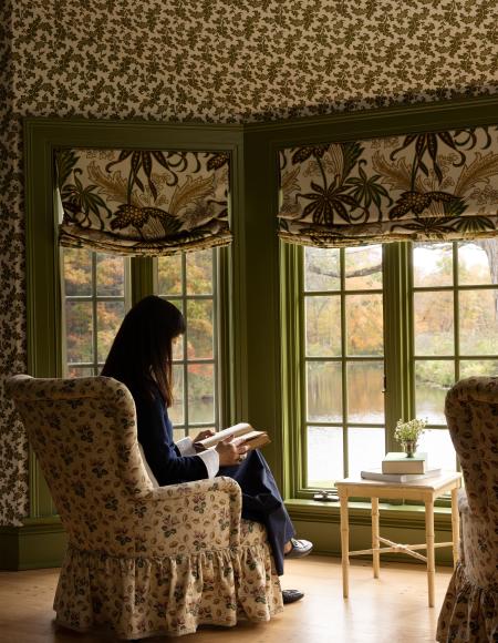 Young sitting at bedroom windows