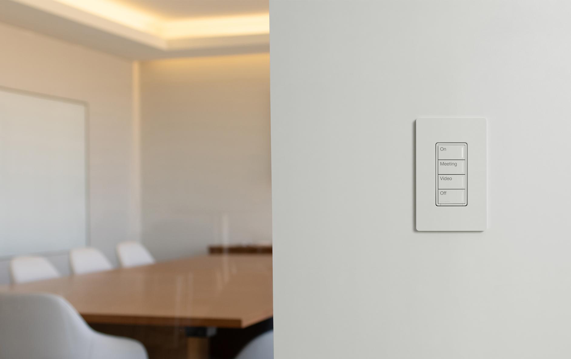 Conference room with Sunnata wireless keypad featuring scene buttons for hybrid dimming and lighting control