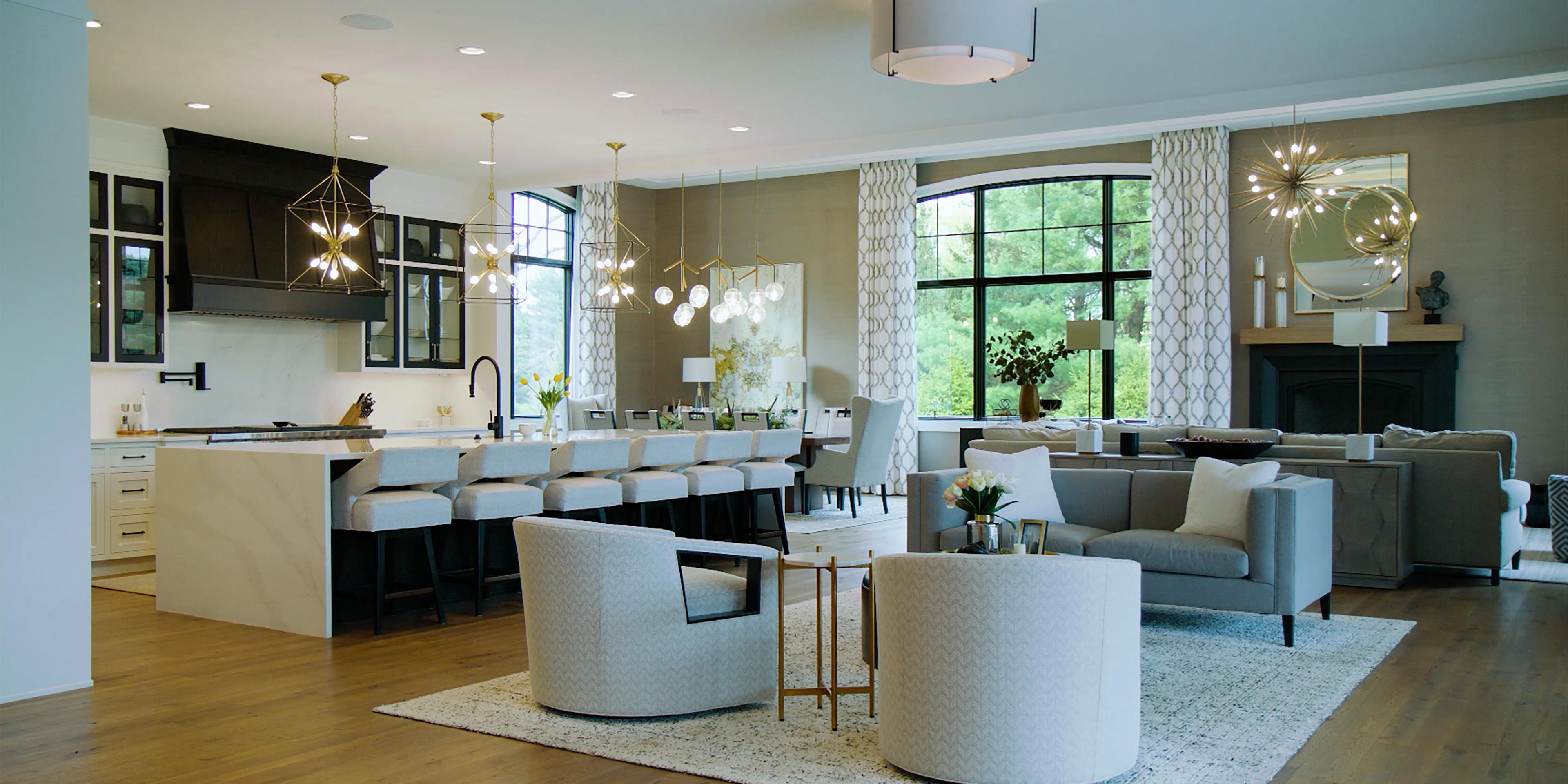 Modern open-concept kitchen and living space with RadioRA 3 lighting control.